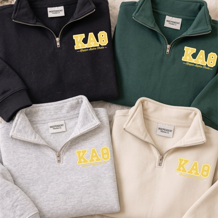 a group of four polo shirts sitting on top of a bed