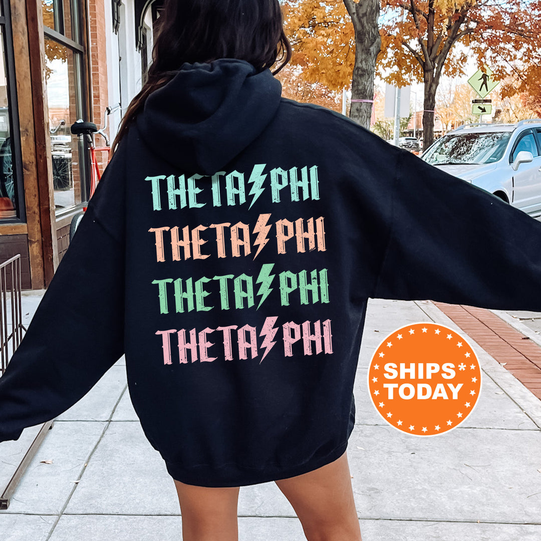 a woman wearing a black hoodie with the words, the ph thera phi