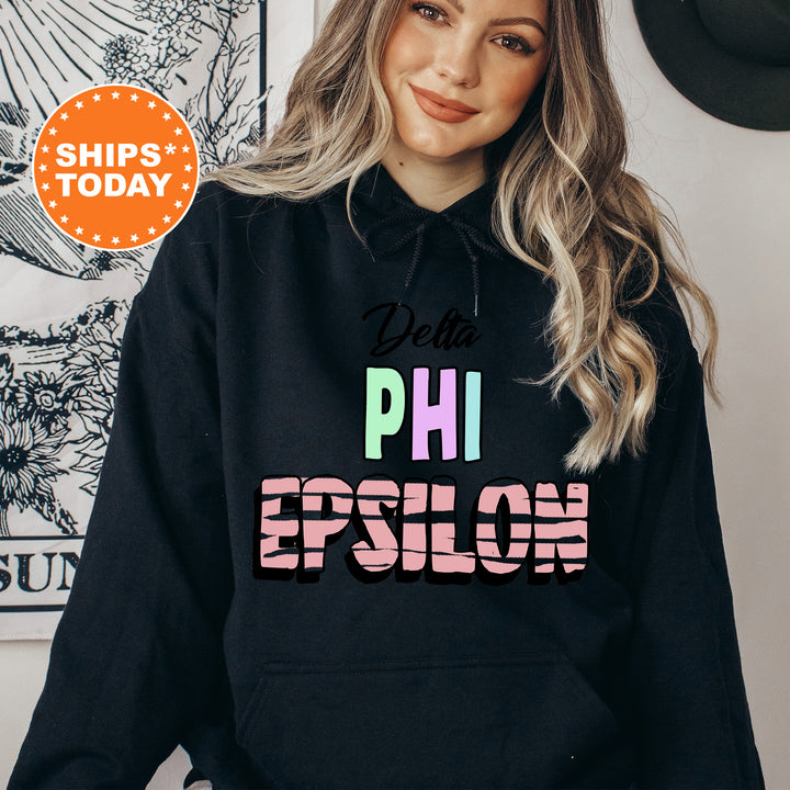 a woman wearing a black hoodie that says delta phi epiloh