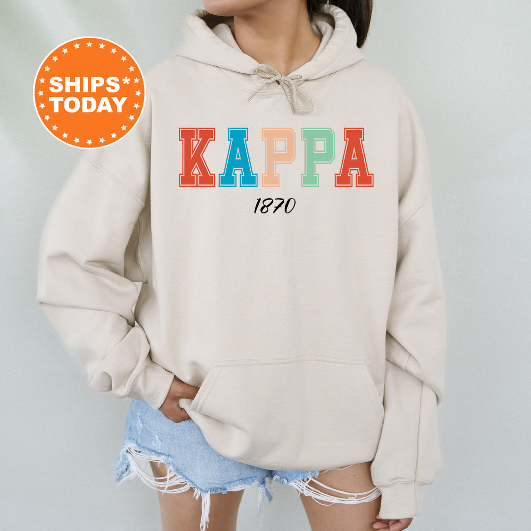 a woman wearing a sweatshirt with the word kappa on it