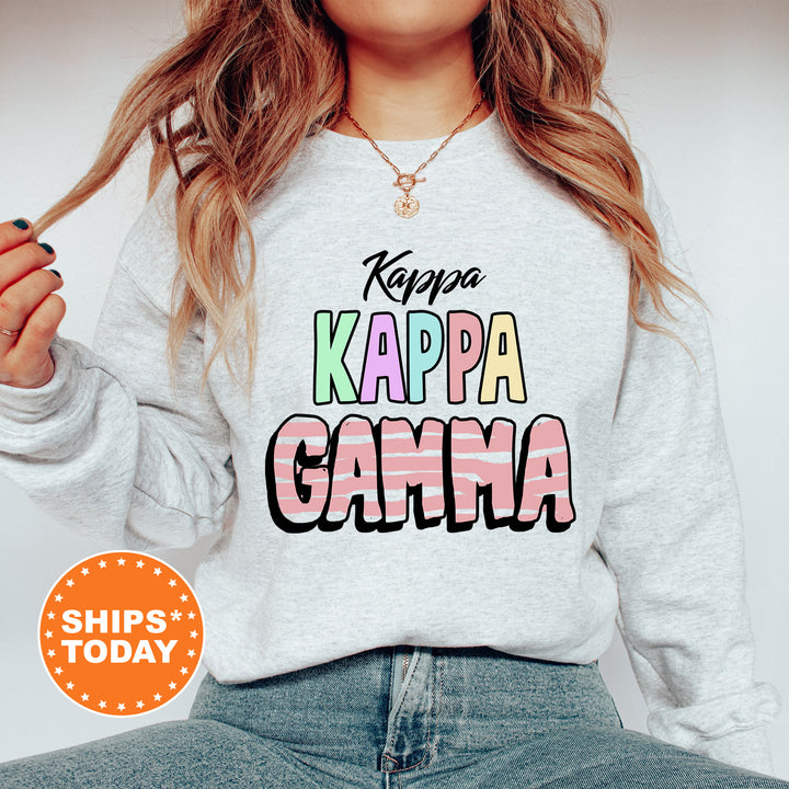 a woman wearing a sweatshirt that says kapa kapa kapa gama