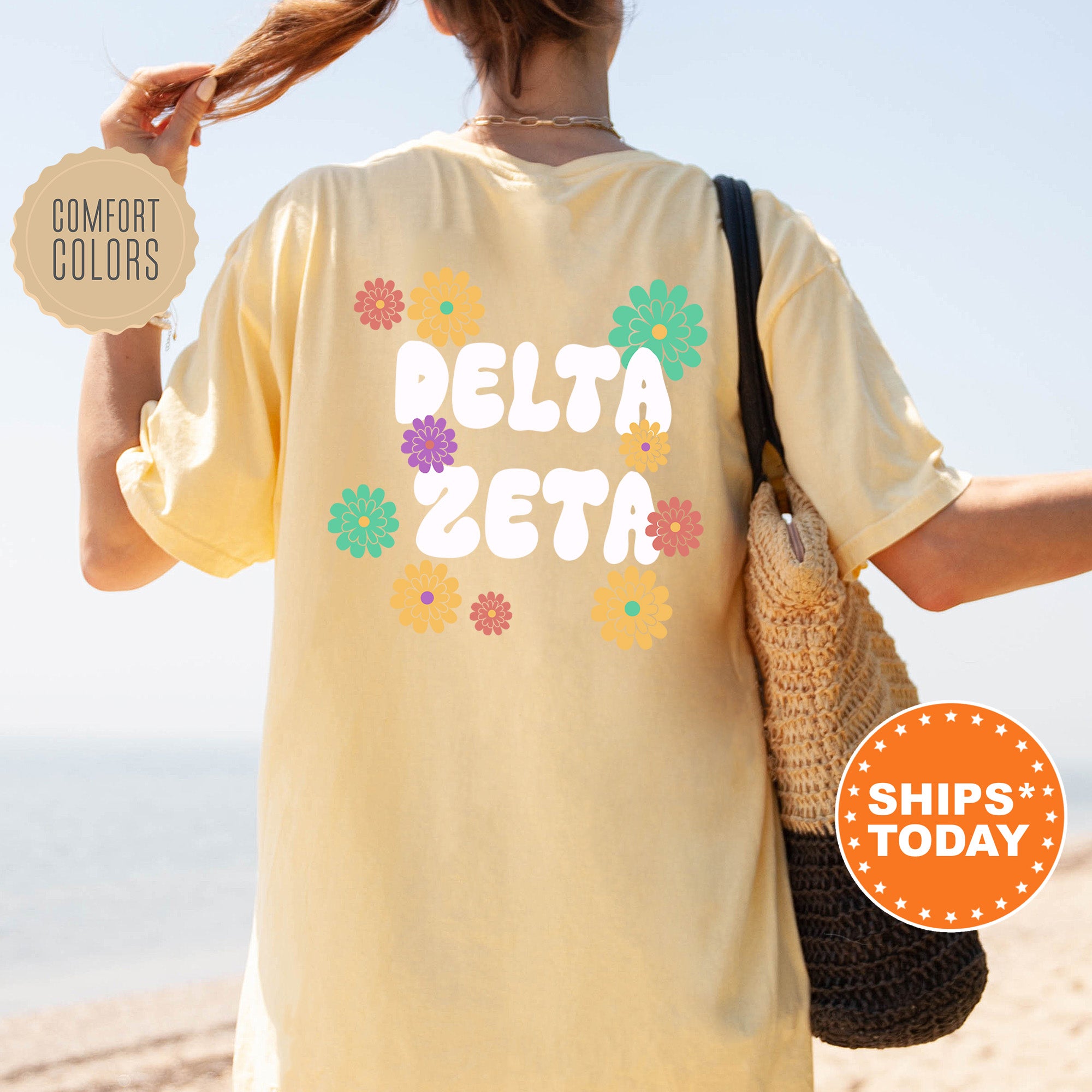 a woman walking on the beach with a bag and a t - shirt that says