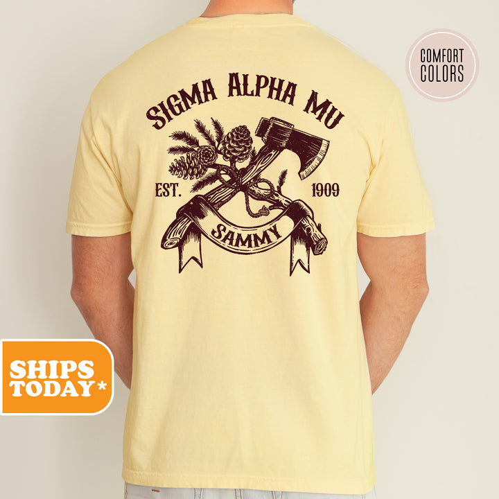 a man wearing a yellow shirt with an image of a hammer and a skull on