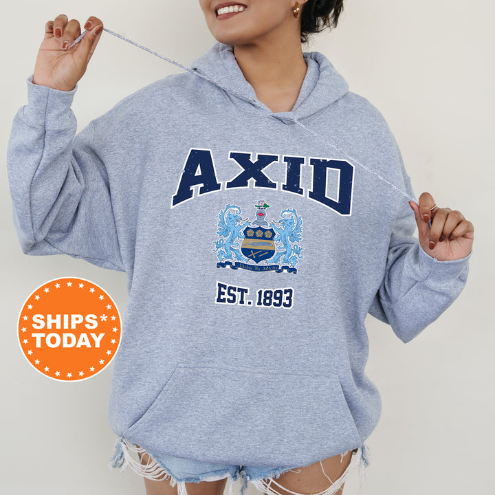 a woman in a blue hoodie is holding a toothbrush
