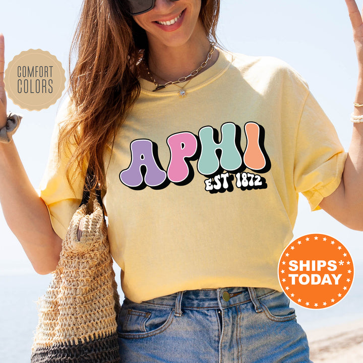 a woman in a yellow shirt holding up a peace sign