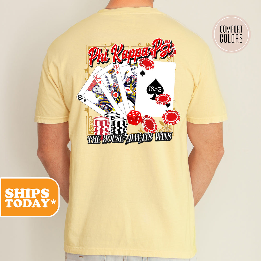 a man wearing a yellow shirt that has a picture of a card game on it