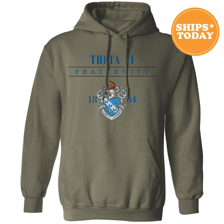 a green hoodie with a blue and white crest on it