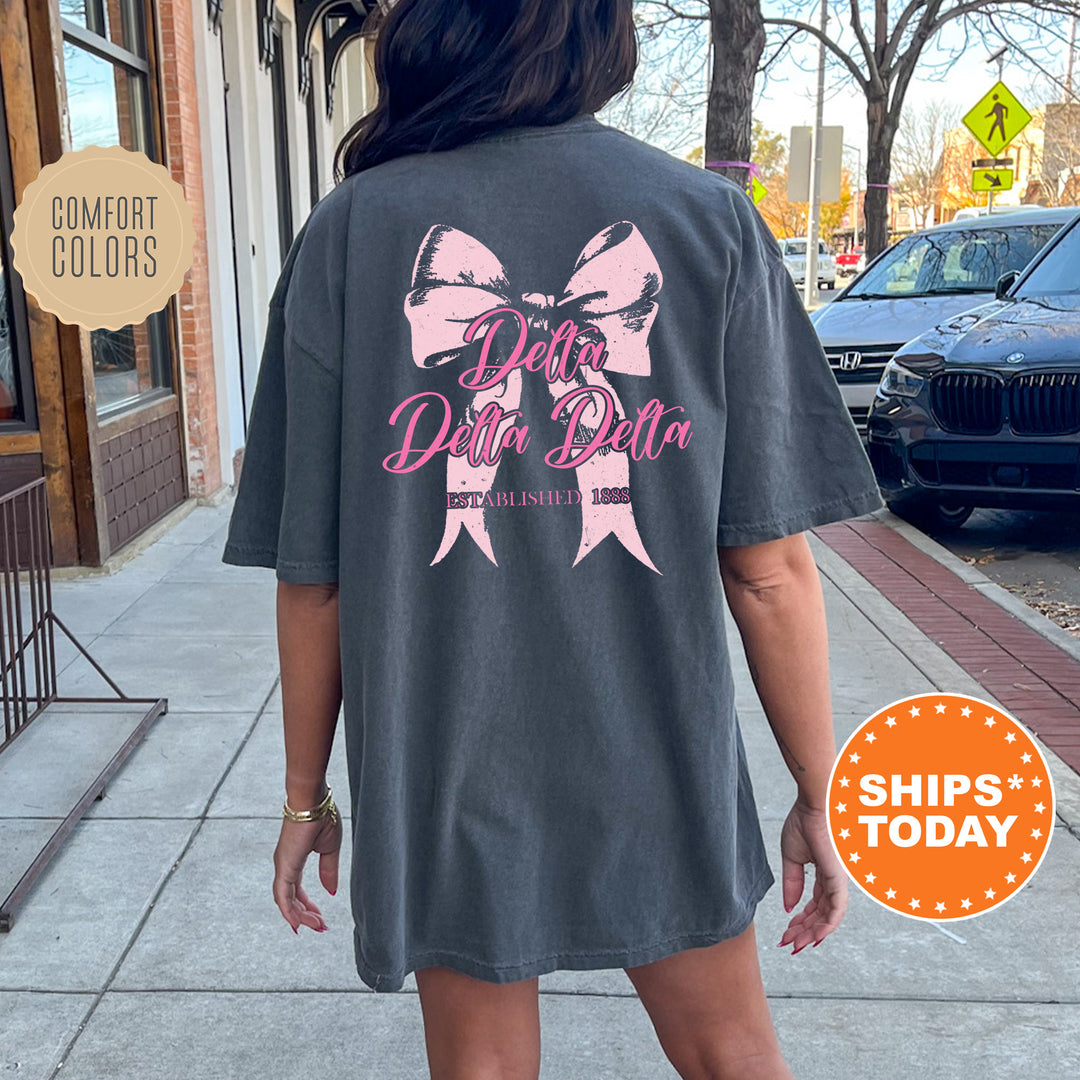 a woman is walking down the sidewalk wearing a shirt with a bow on it