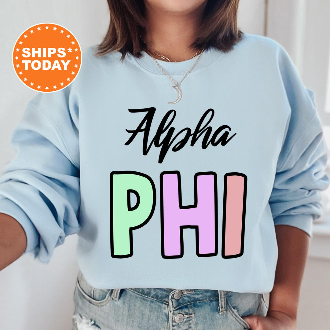 a woman wearing a light blue sweatshirt with the words ahoh phi on it