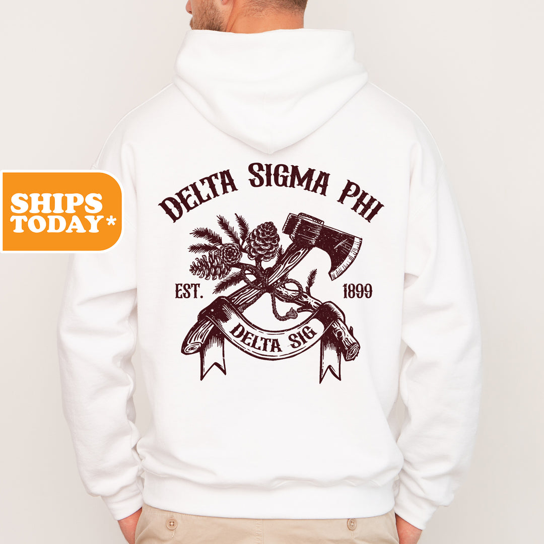 a man wearing a white hoodie with an image of a hammer and a pine