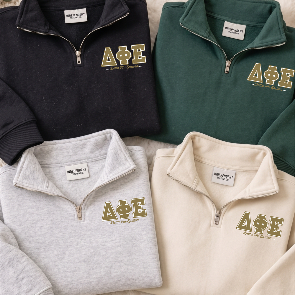 a collection of four different colored zip-up sweatshirts, each with the letters "ΑΕΛΙΑ" printed on them.