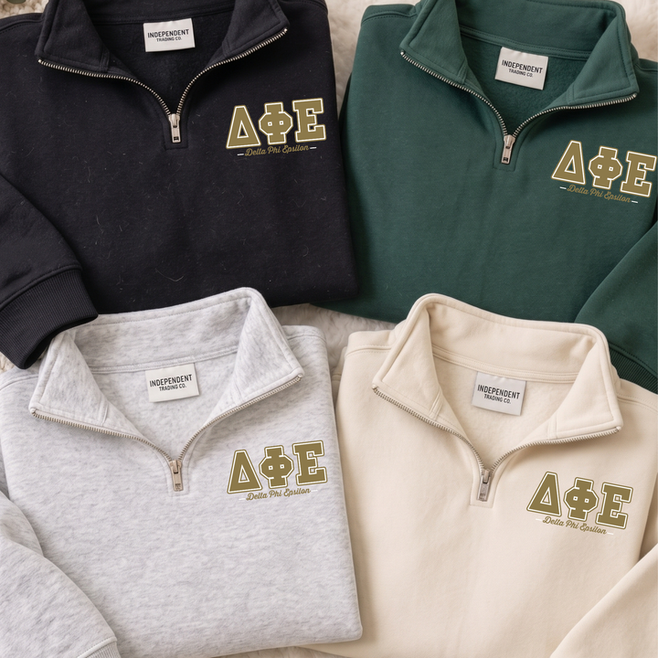 a collection of four different colored zip-up sweatshirts, each with the letters "ΑΕΛΙΑ" printed on them.