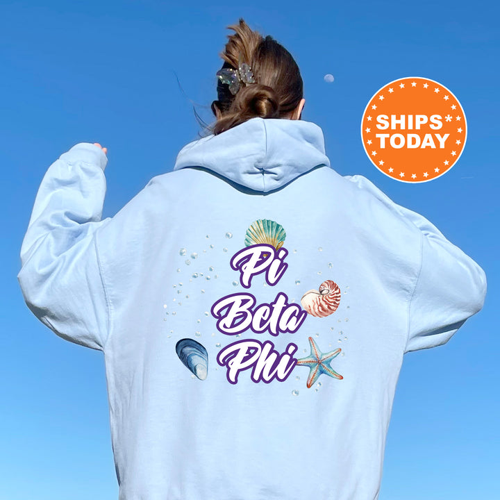 a woman wearing a white hoodie with the words pi bec pi on it