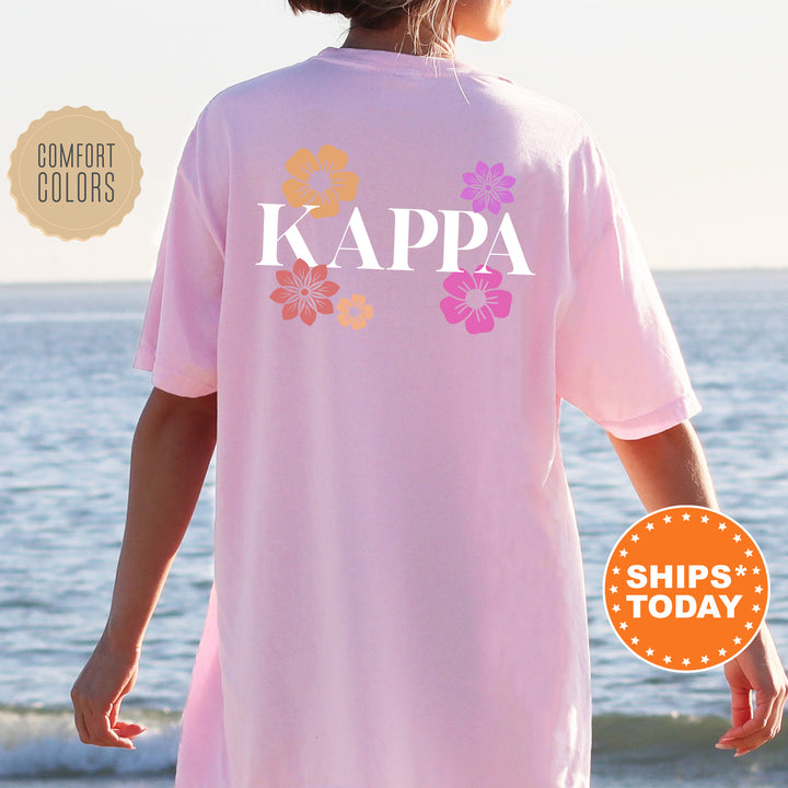 a woman wearing a pink shirt that says kappa