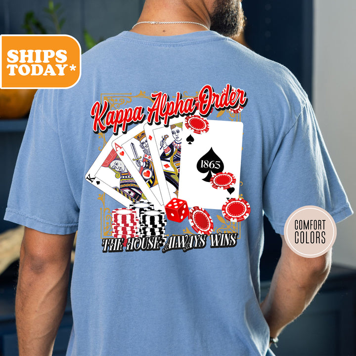 a man wearing a blue shirt with a picture of playing cards