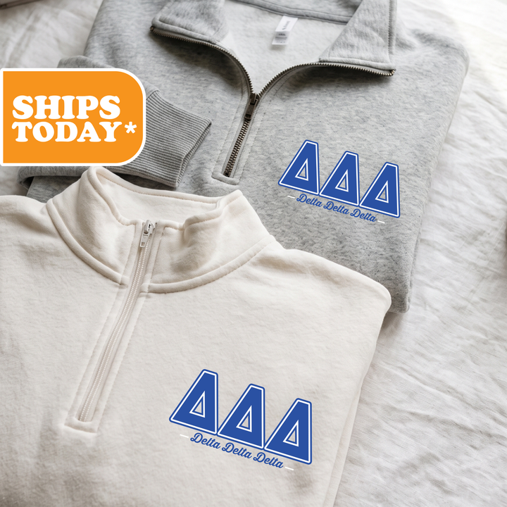 Two gray sweatshirts with the Delta Delta Delta logo printed on them, along with a gray sweatshirt with a zipper and a white sweatshirt with a zipper.