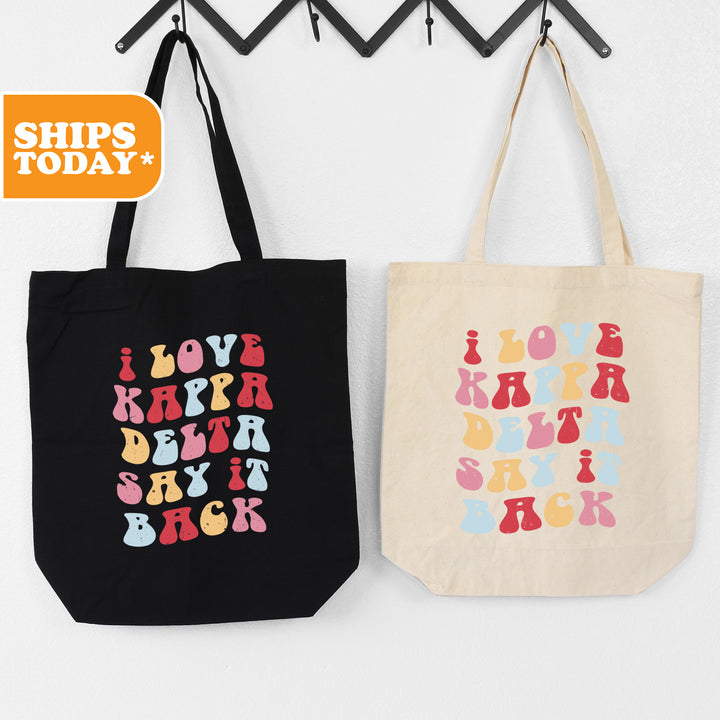 two shopping bags hanging on a wall