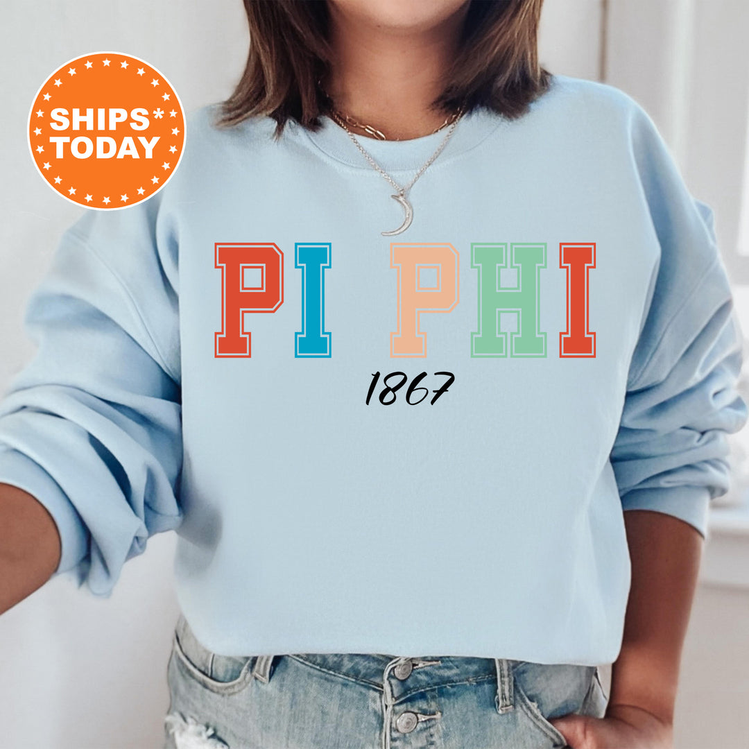 a woman wearing a sweatshirt that says pi phi