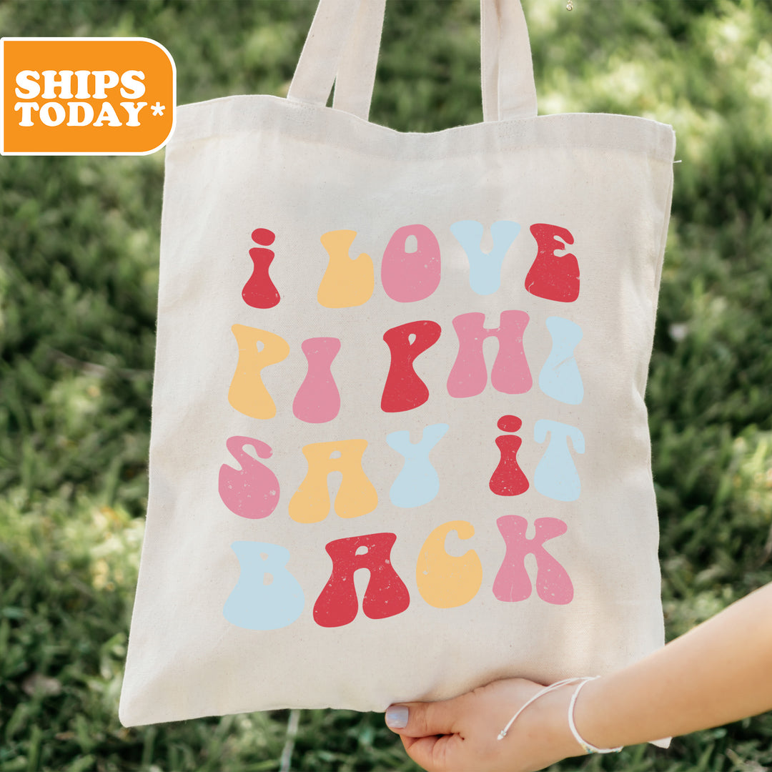 a person holding a tote bag with a design on it