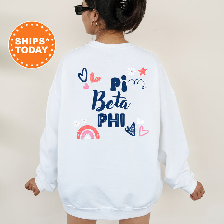 a woman wearing a white sweatshirt with the words pi beta phi on it