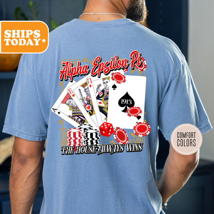 a man wearing a blue shirt with playing cards on it