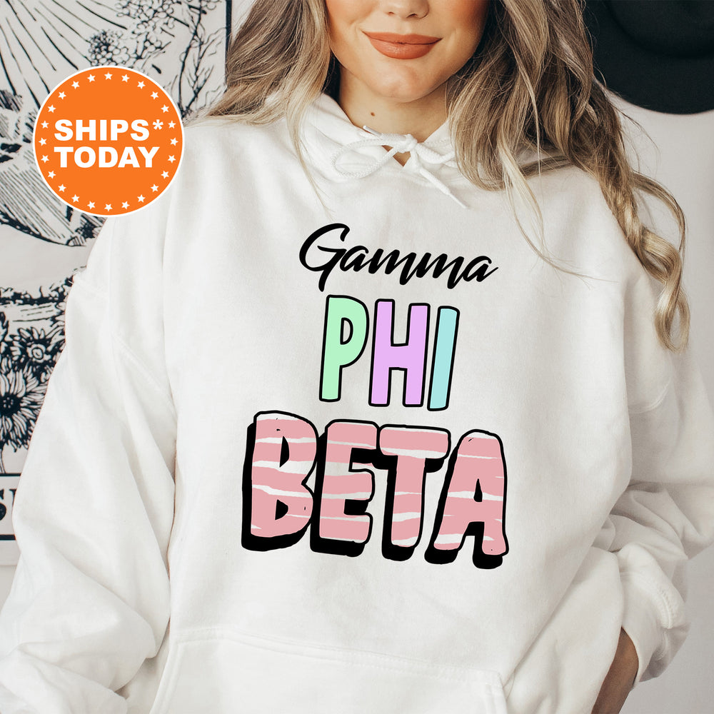 a woman wearing a white hoodie that says gumma phi beta