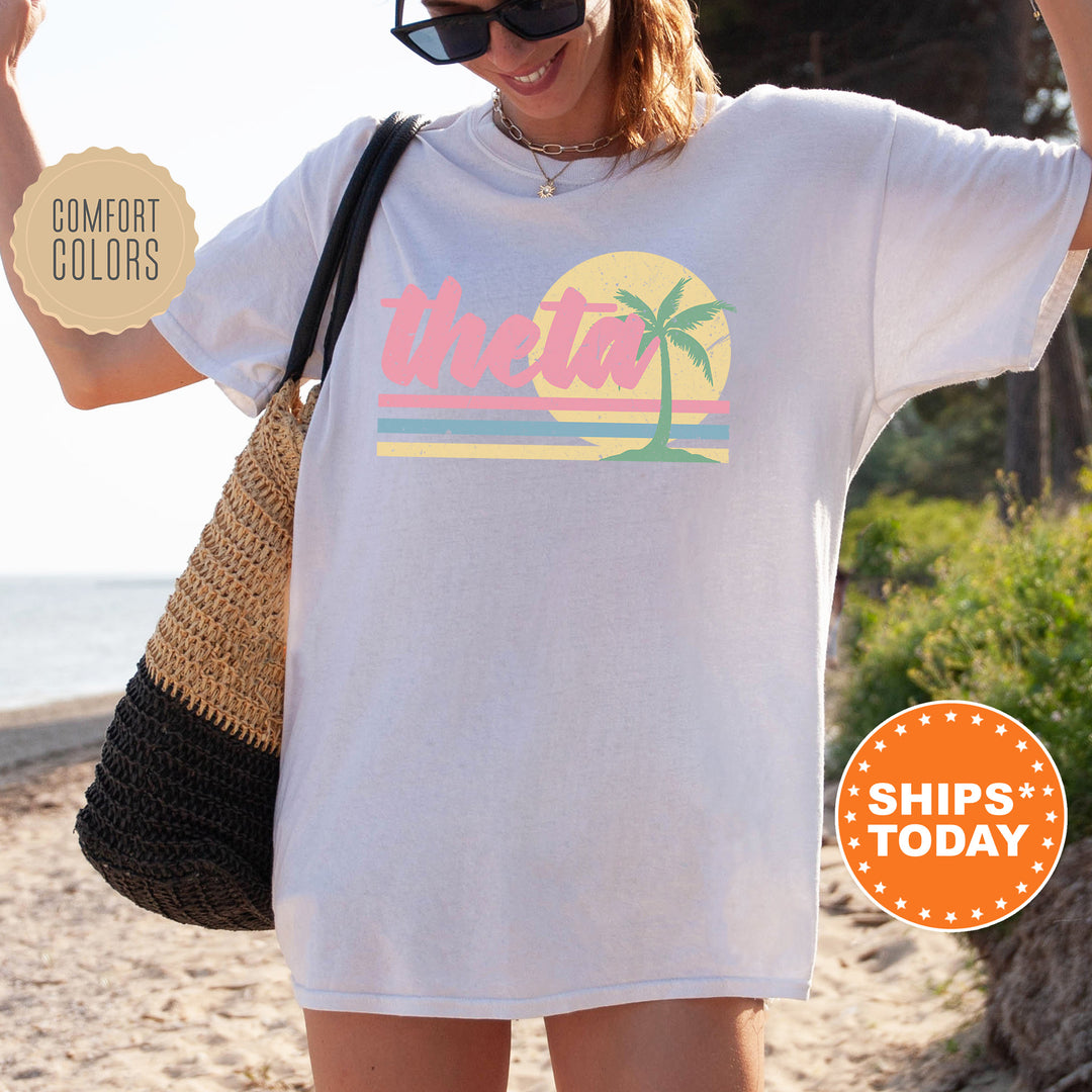 a woman wearing a white shirt with a palm tree on it