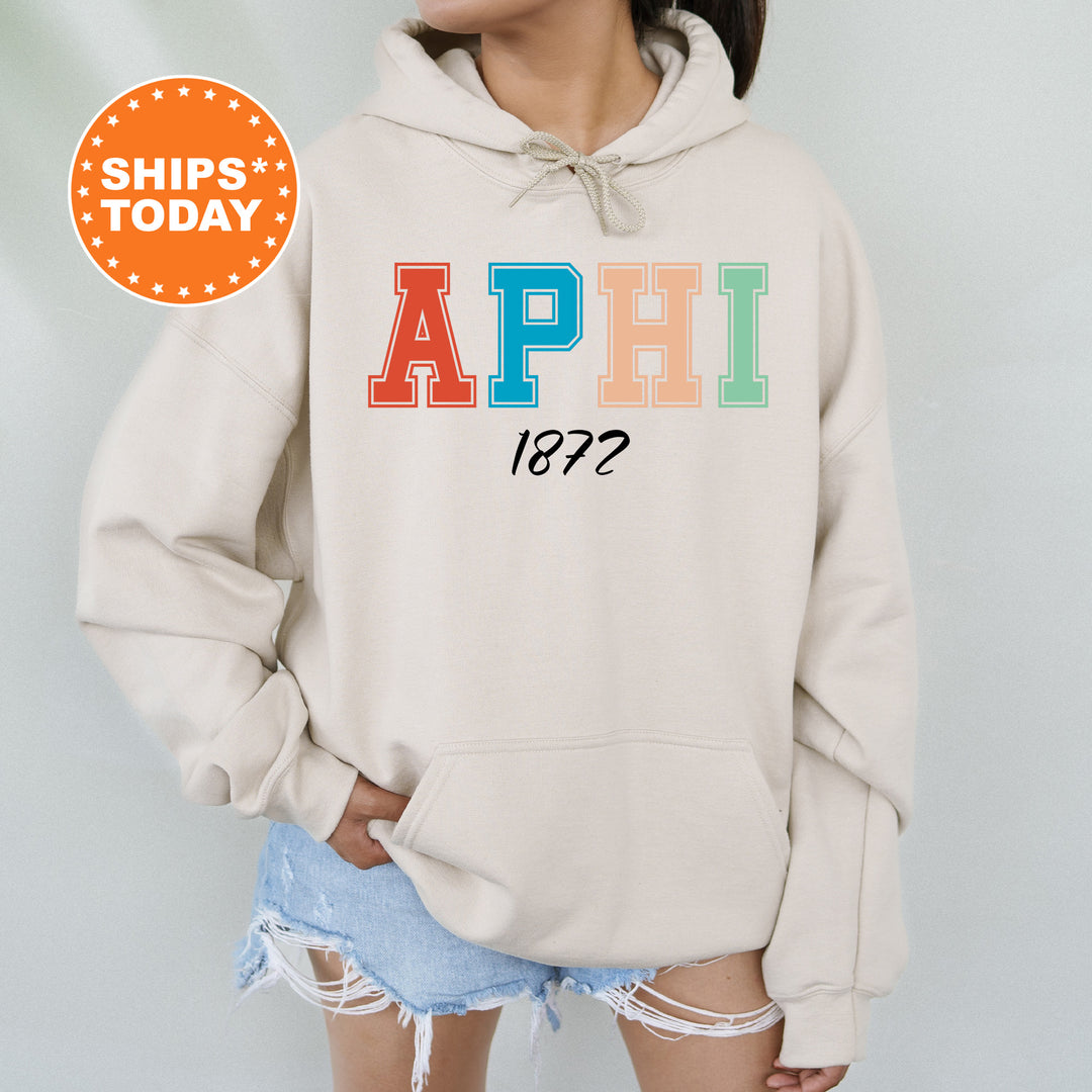 a woman wearing a sweatshirt with the word aphi printed on it