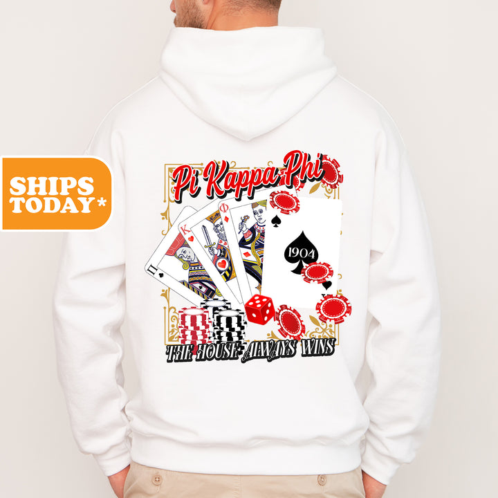 a man wearing a white hoodie with playing cards on it