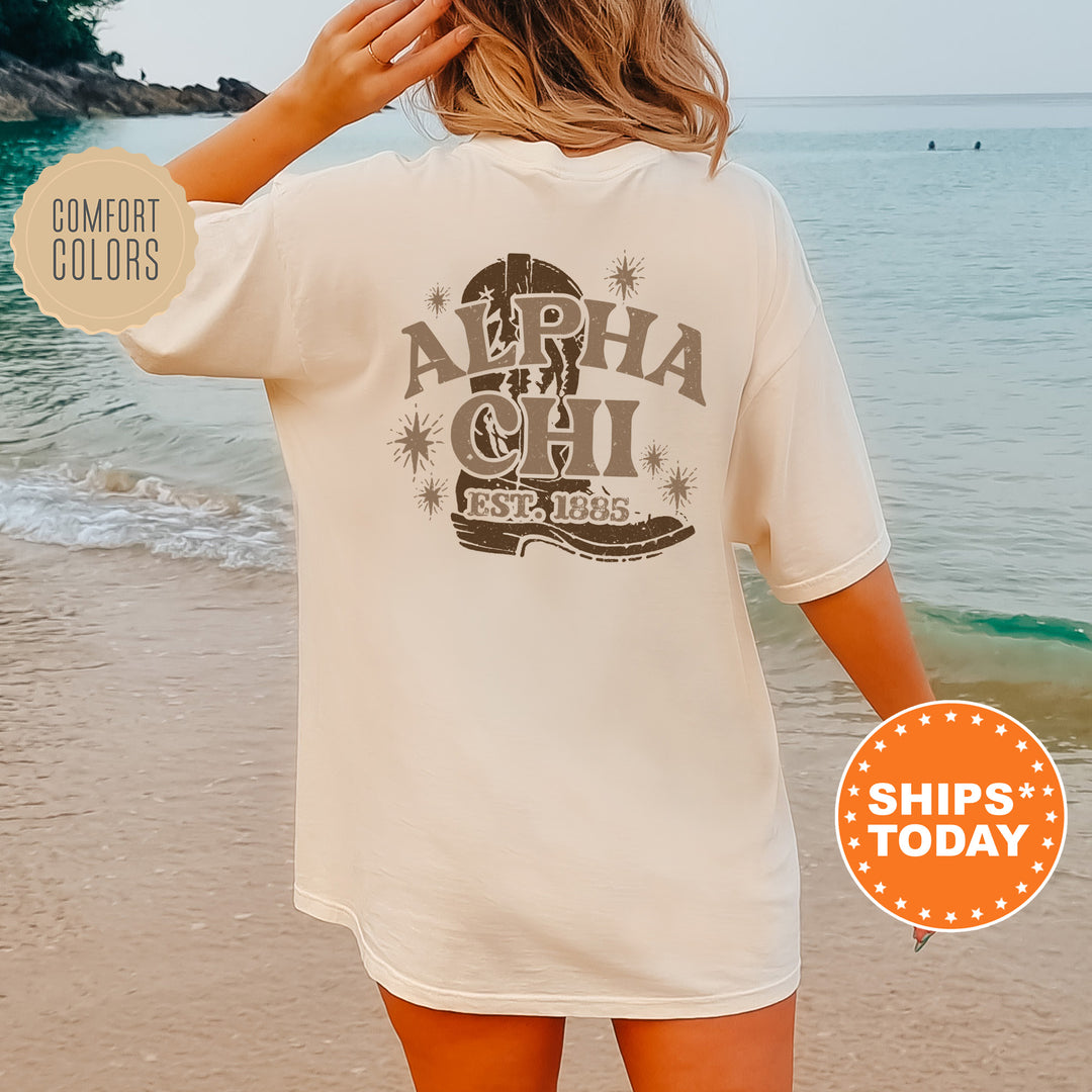 a woman standing on a beach wearing a white shirt