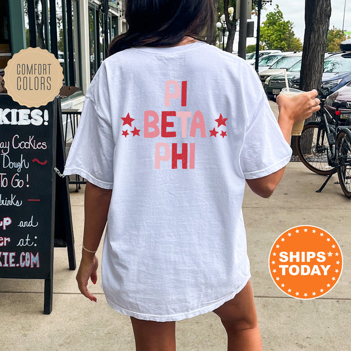 a woman walking down a sidewalk holding a donut