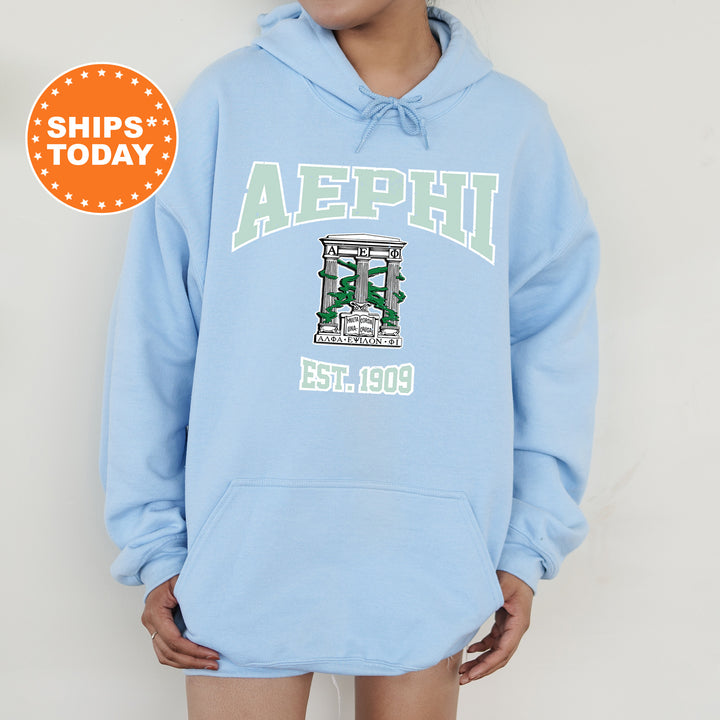 a person wearing a light blue hoodie with the words aephii on it