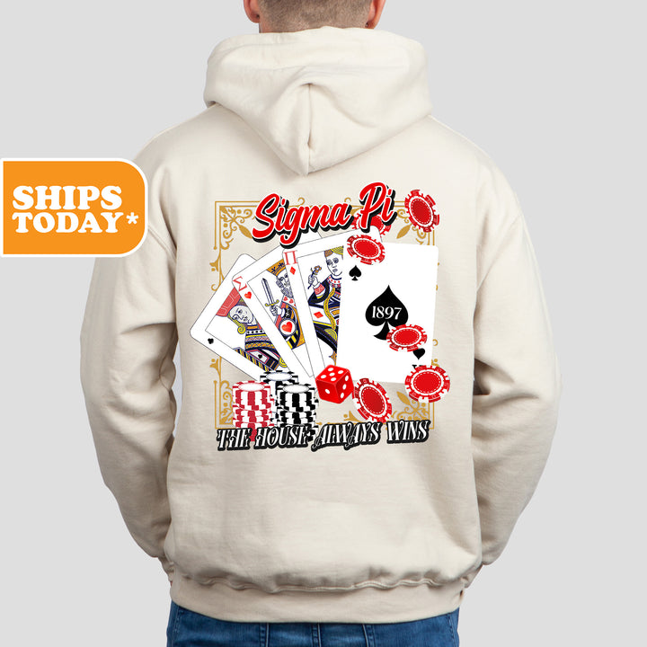 a man wearing a white hoodie with a picture of a playing card on it