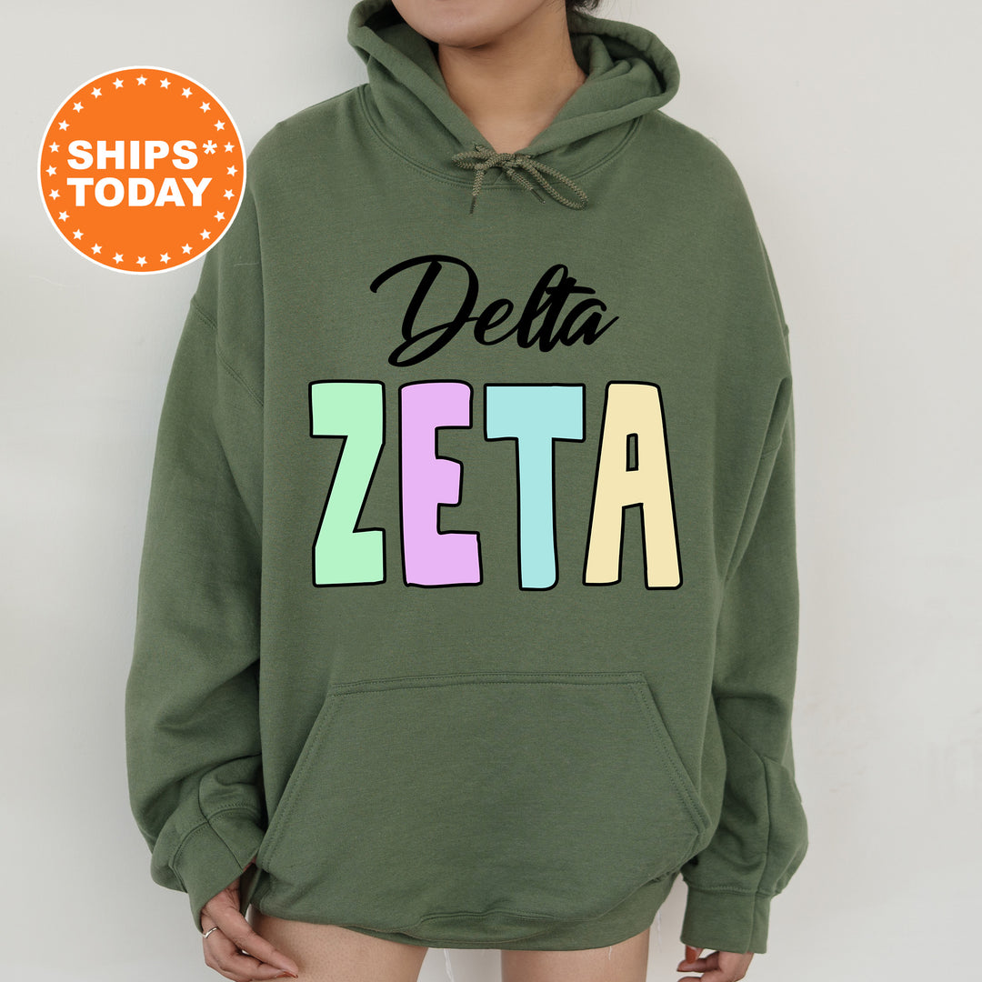 a woman wearing a green delta delta hoodie