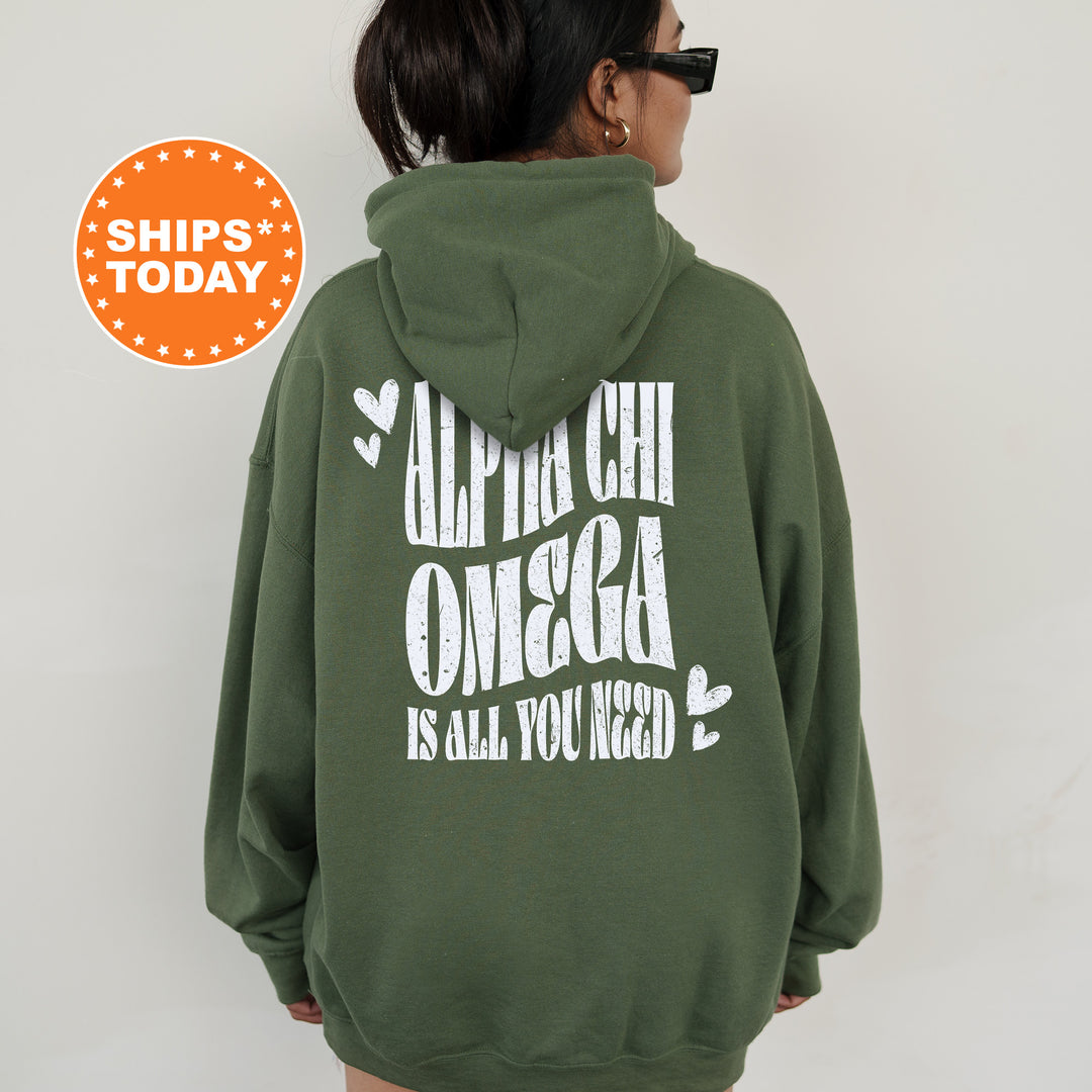 a woman wearing a green hoodie with white lettering