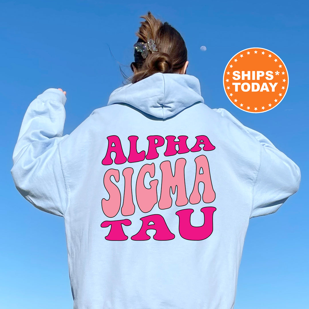 a woman wearing a white hoodie with the words alpha sigma