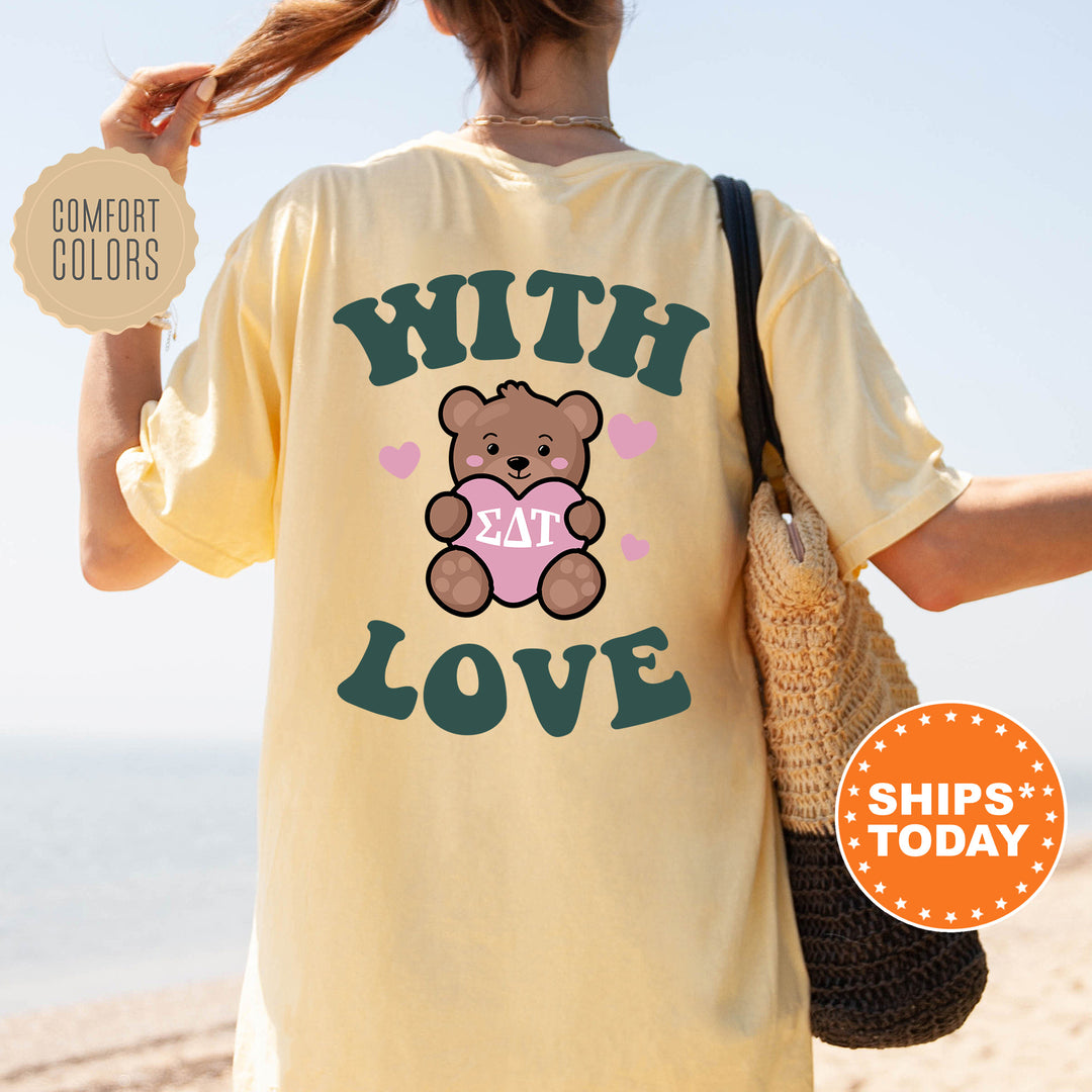 a woman wearing a t - shirt with a teddy bear on it