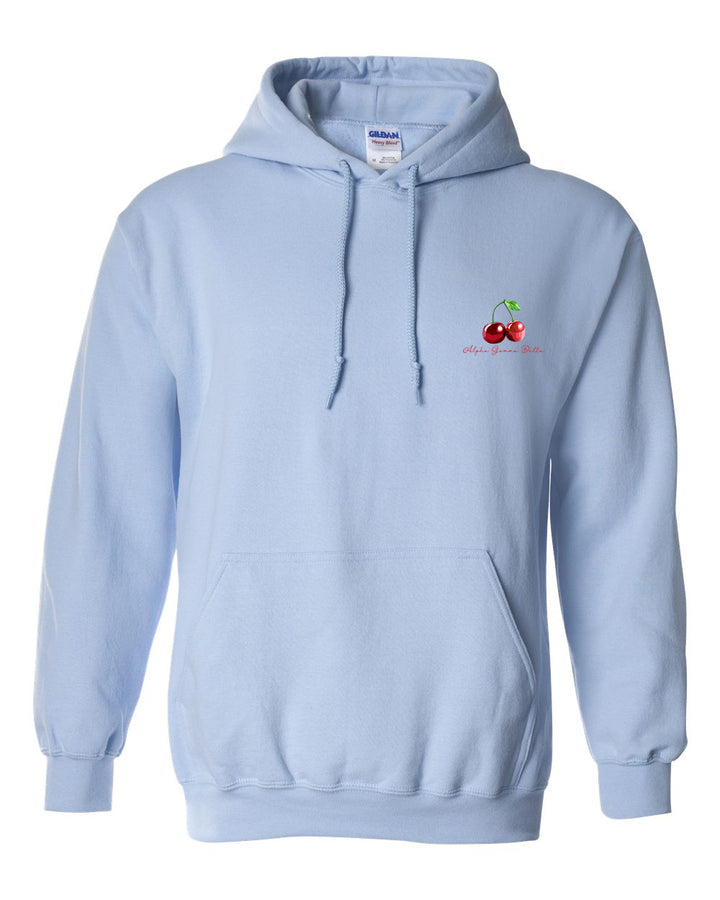 a light blue sweatshirt with a cherry embroidered on the chest