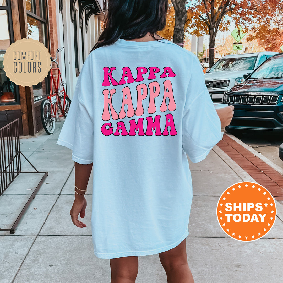 a woman is walking down the sidewalk wearing a t - shirt that says kapa