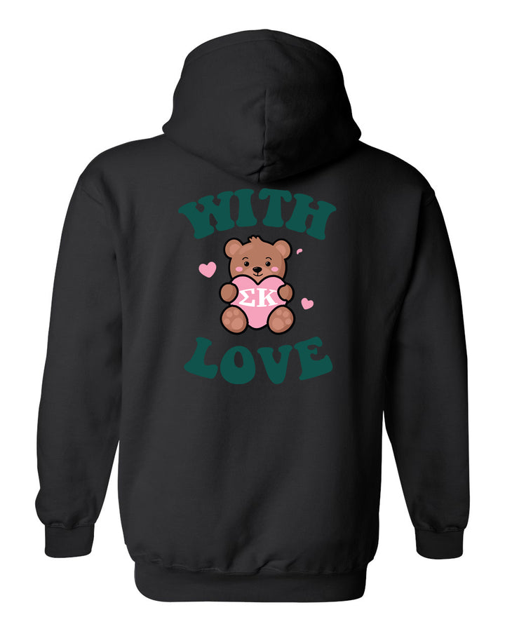 a black hoodie with a teddy bear holding a heart