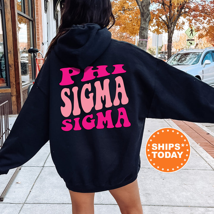 a woman in a black hoodie that says phi sigma sigma