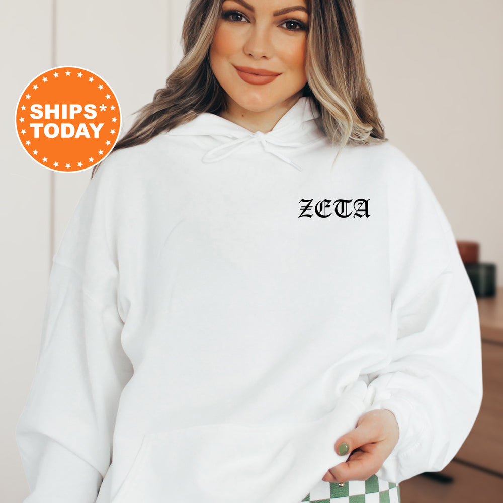 a woman wearing a white hoodie with the word zeba printed on it