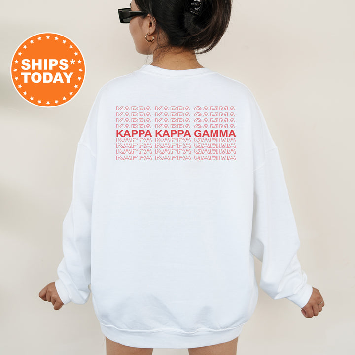 a woman wearing a white sweatshirt with the words kapa kapa gama printed