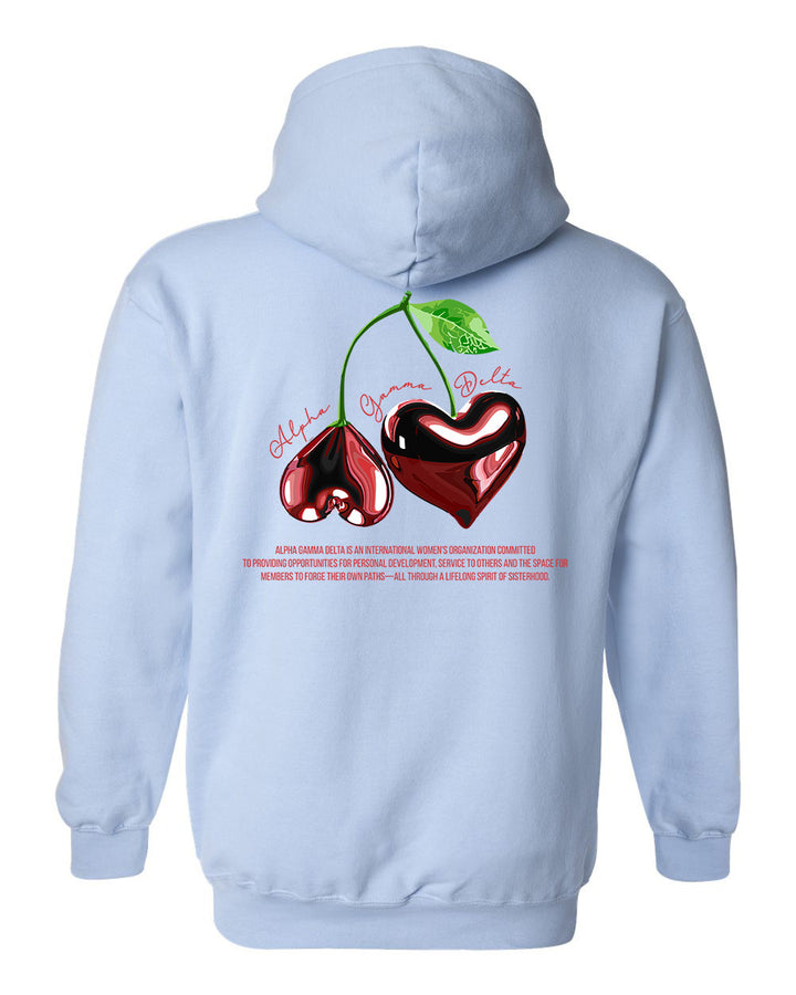 a blue hoodie with two cherries on it