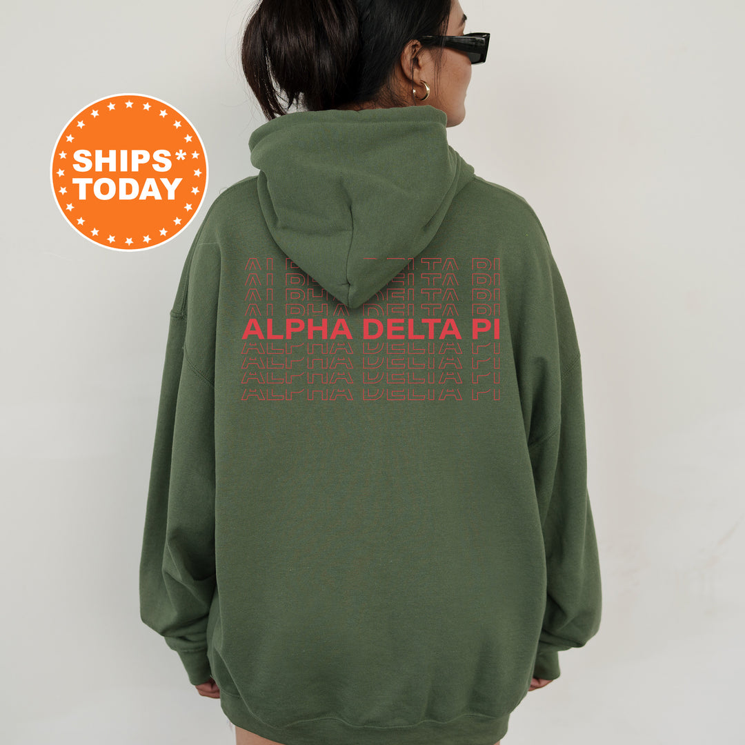 a woman wearing a green hoodie with the words delta delta printed on it