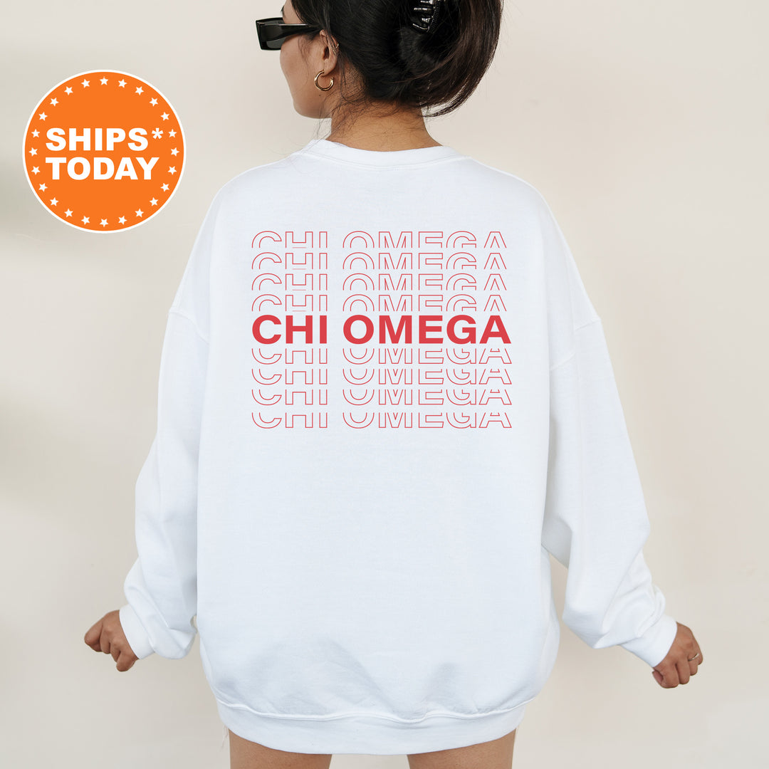 a woman wearing a white sweatshirt with the words chi omega printed on it