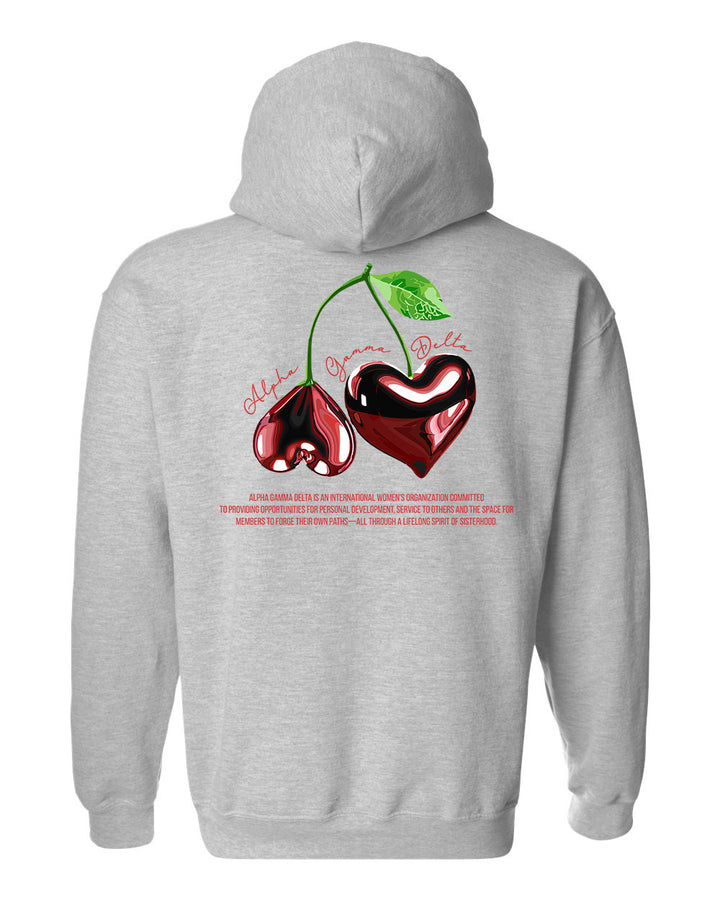 a grey hoodie with two cherries on it
