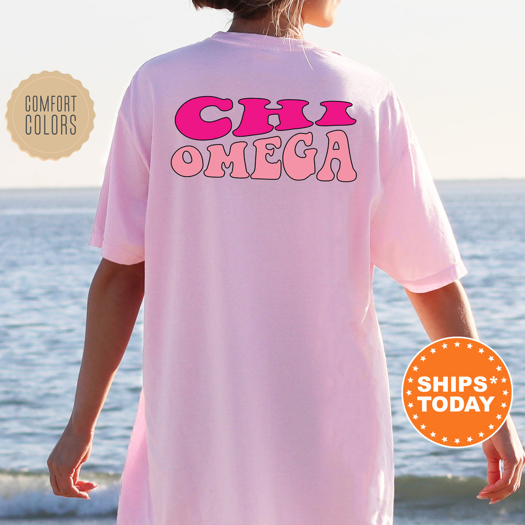 a woman wearing a pink shirt with the words cin omeca on it