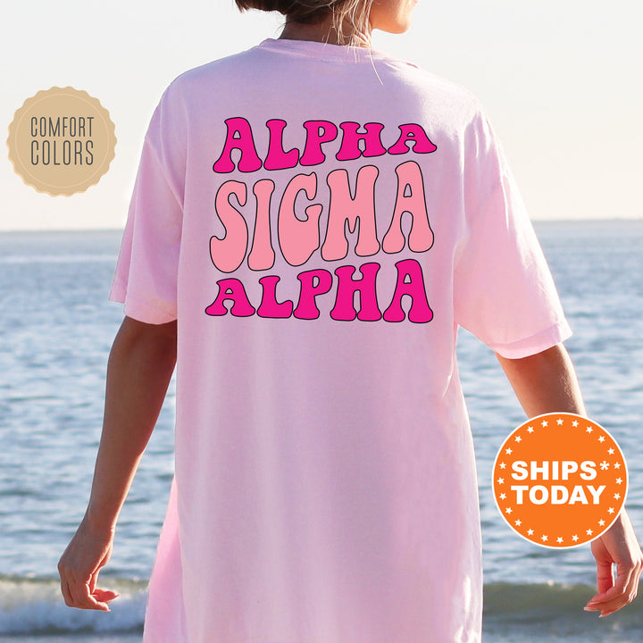 a woman wearing a pink shirt that says, aloha sigma al