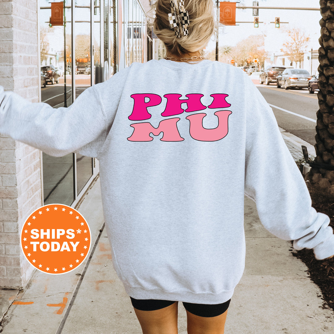a woman walking down a sidewalk wearing a sweatshirt